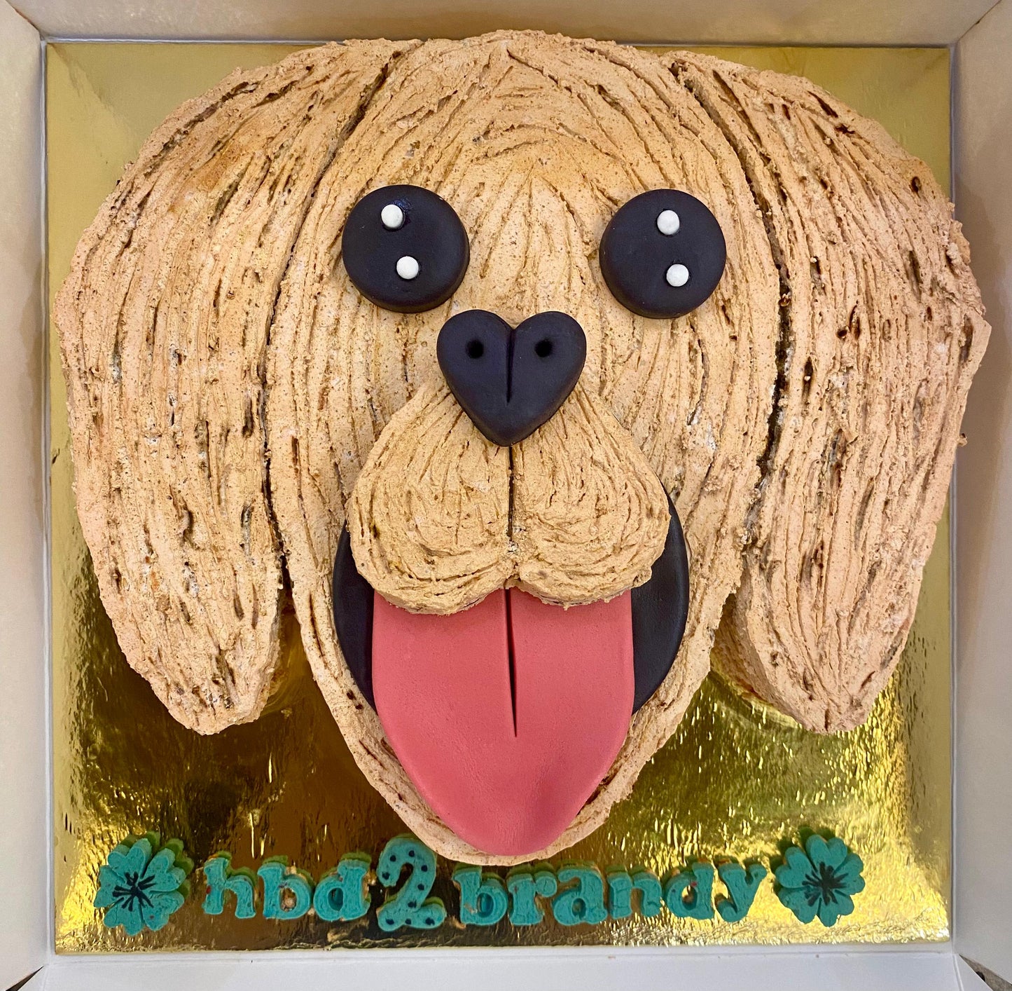 Golden Retriever face-shaped birthday cake for dogs with peanut butter and oats, made in Dehradun
