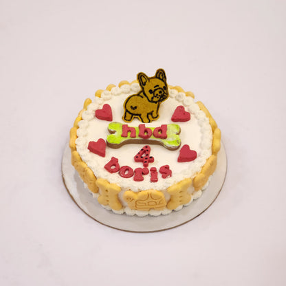 A decorated cookie cake with a dog figurine in Dehradun